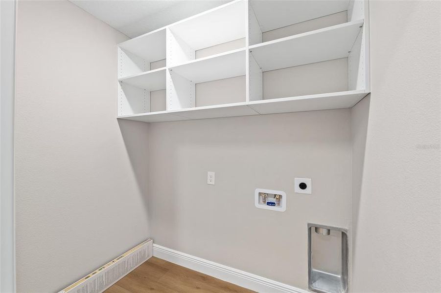 laundry room with shelving