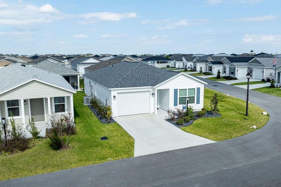 Front exterior of a new home in , The Villages, FL, highlighting curb appeal (Image 30).