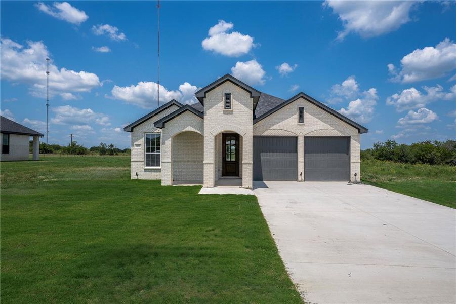 Front exterior of a new home in , Corsicana, TX, highlighting curb appeal (Image 2). Front exterior of a new home in , Corsicana, TX, highlighting curb appeal (Image 2).