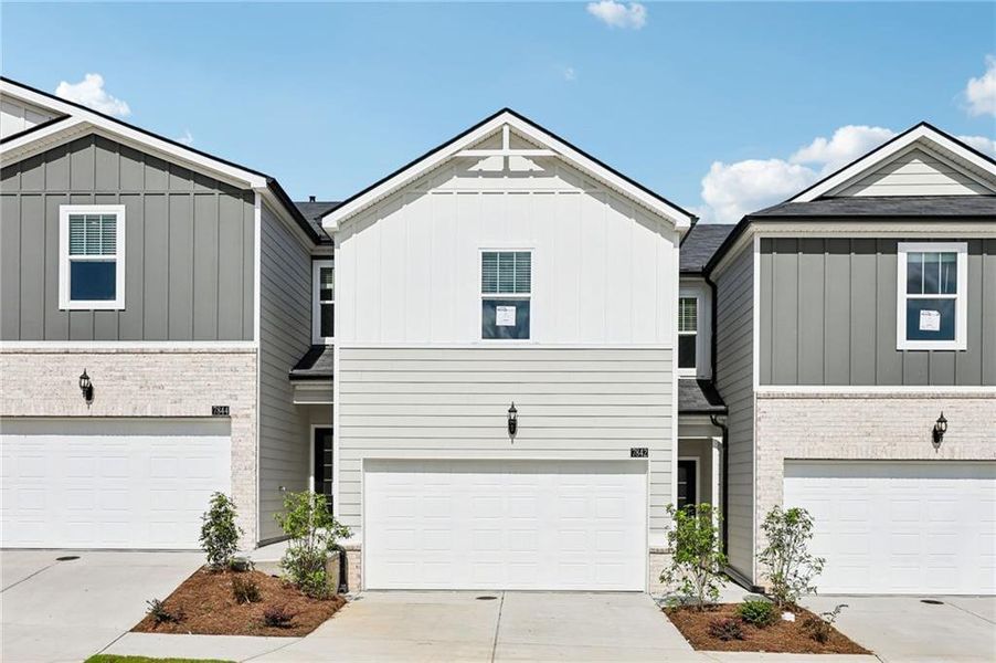 Front exterior of a new home in Artisan Walk, Fairburn, GA, highlighting curb appeal (Image 21).