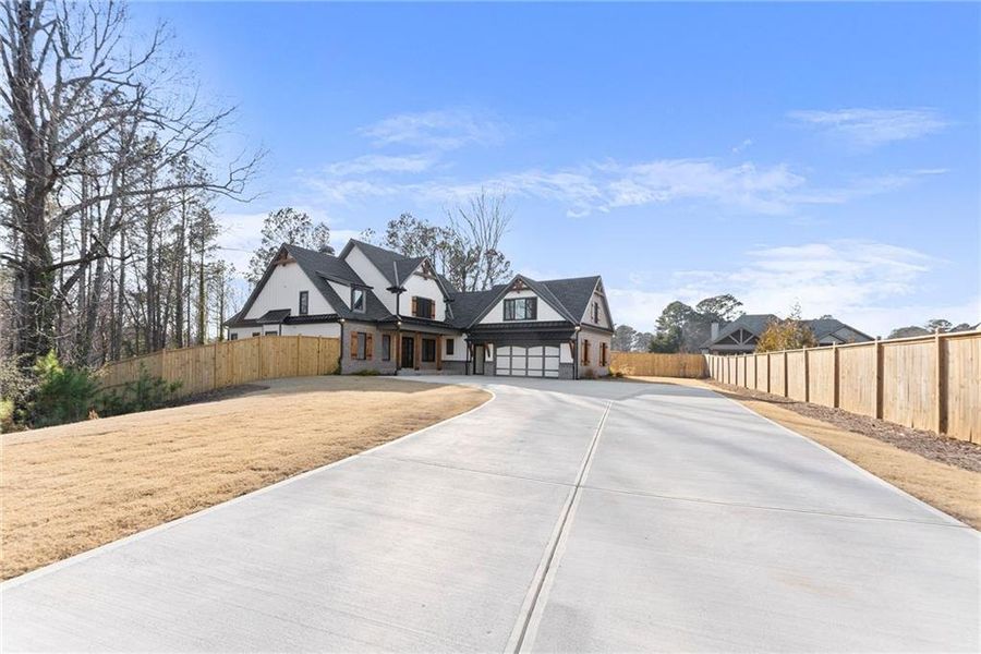 Front exterior of a new home in , Cumming, GA, highlighting curb appeal (Image 29).
