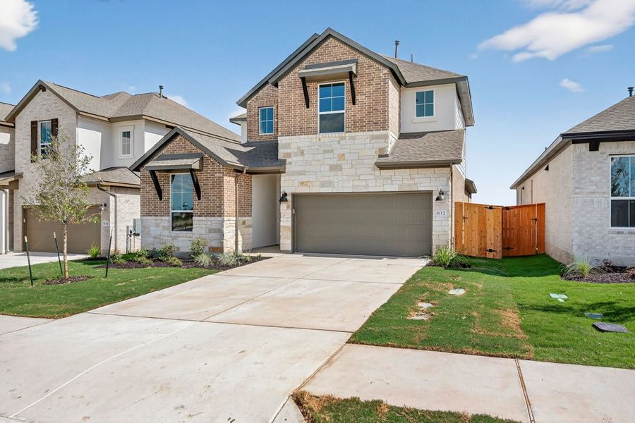 Exterior details and patio area of a home in Arbor Collection at Lariat, Liberty Hill (Image 19). Exterior details and patio area of a home in Arbor Collection at Lariat, Liberty Hill (Image 19).
