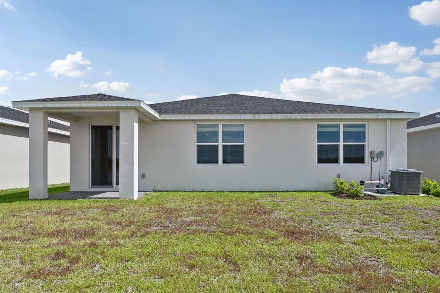 Exterior details and patio area of a home in Hampton Park - Classic Series, Vero Beach (Image 22).