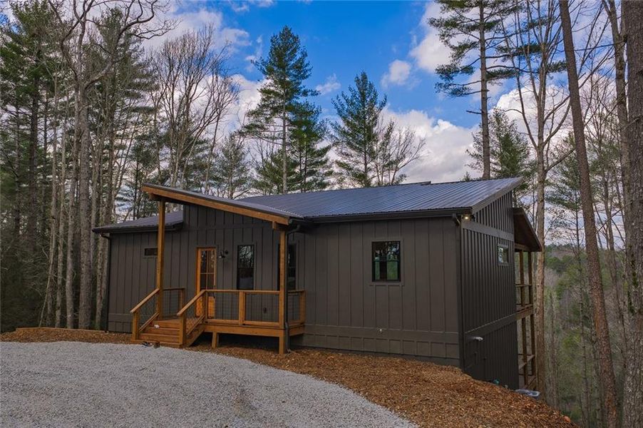 Exterior details and patio area of a home in , Ellijay (Image 18).