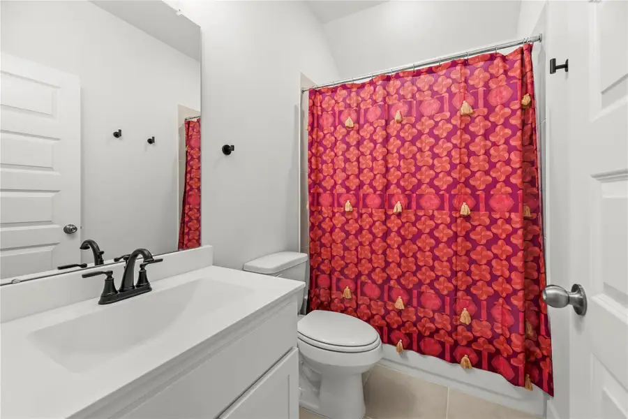 One of two full baths upstairs, this ensuite serves the guest bedroom with ease, providing a private and convenient space for family or overnight visitors.