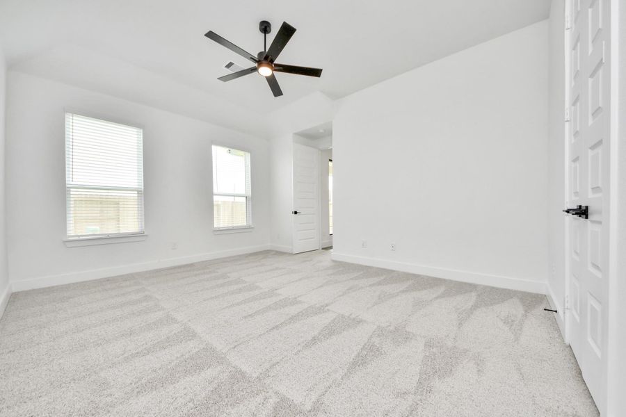 Come and unwind after a long day in this magnificent primary suite! This spacious room features plush carpet, warm paint, high ceilings and large windows with privacy blinds. Come and unwind after a long day in this magnificent primary suite! This spacious room features plush carpet, warm paint, high ceilings and large windows with privacy blinds.