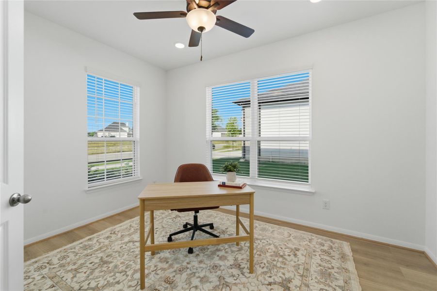 Ample windows illuminate this well-appointed study, ideal for productivity. Ample windows illuminate this well-appointed study, ideal for productivity.
