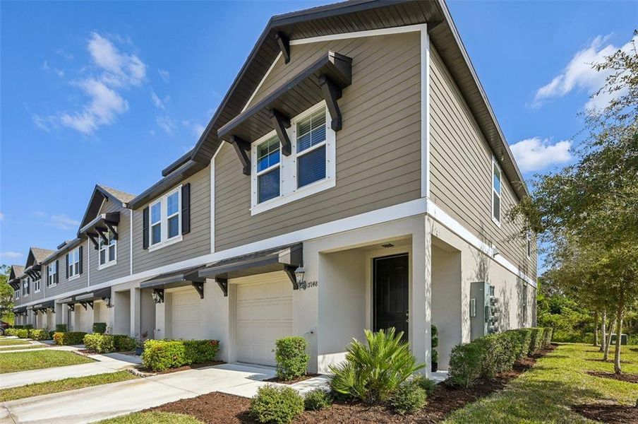 Front exterior of a new home in , Nokomis, FL, highlighting curb appeal (Image 1).