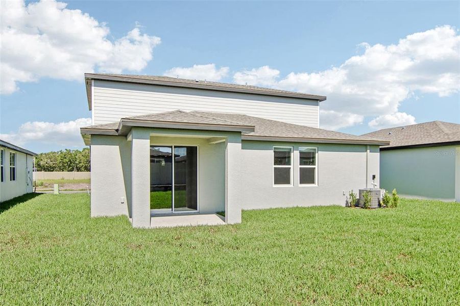 Front exterior of a new home in Two Rivers - Classic Series, Zephyrhills, FL, highlighting curb appeal (Image 15).