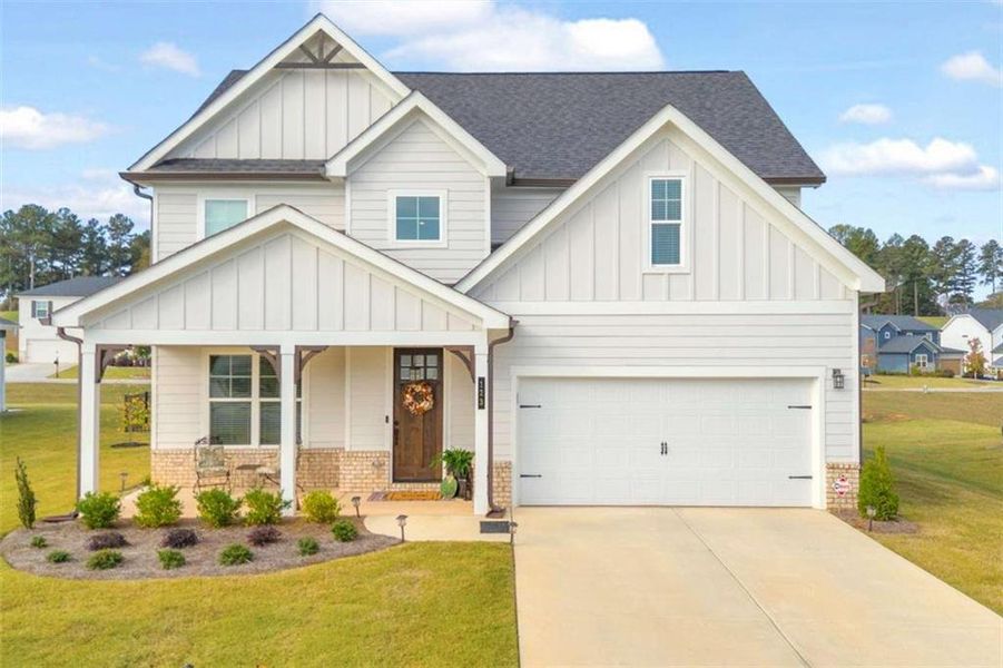 Front exterior of a new home in , Homer, GA, highlighting curb appeal (Image 24).