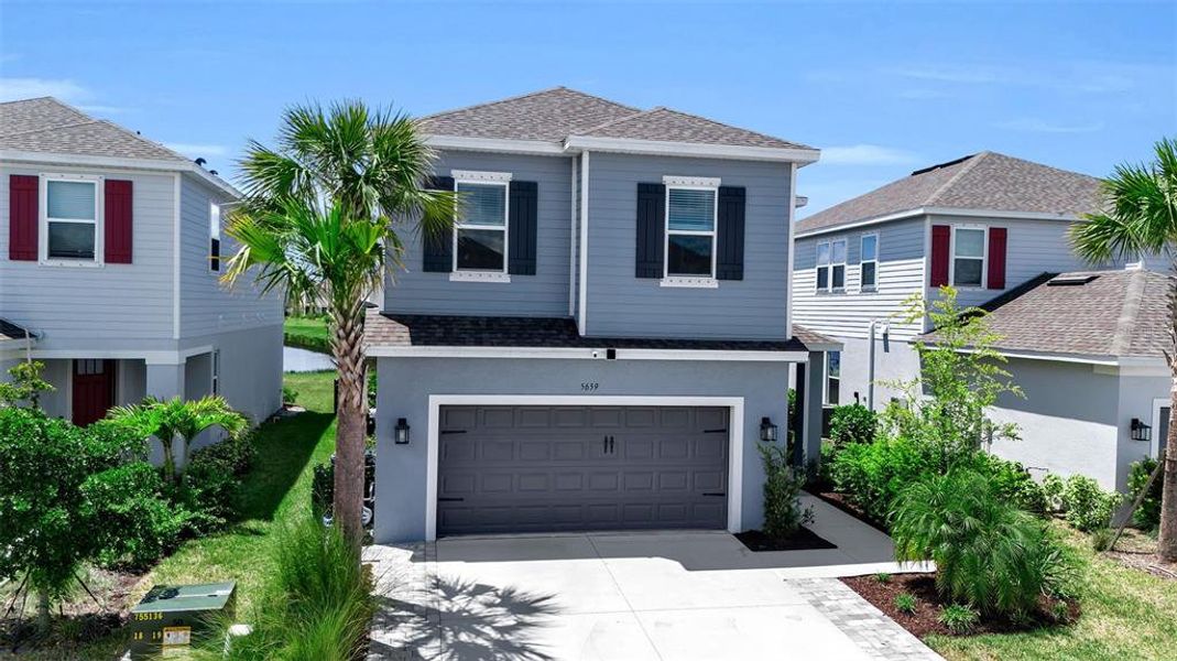 Front exterior of a new home in , Nokomis, FL, highlighting curb appeal (Image 24).