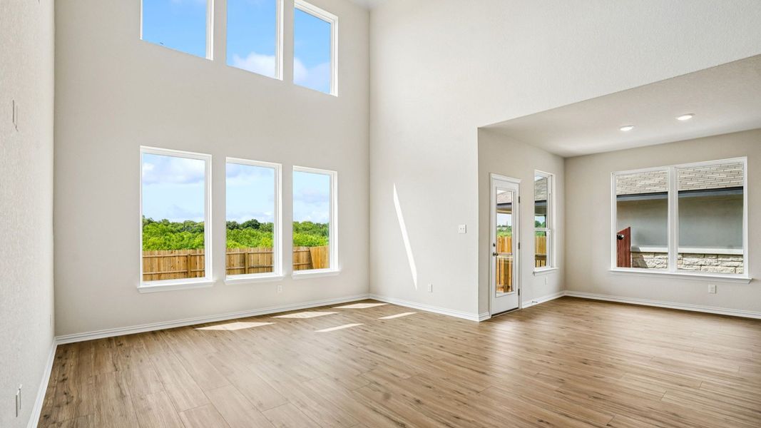 Great Room features picture windows and soaring ceilings