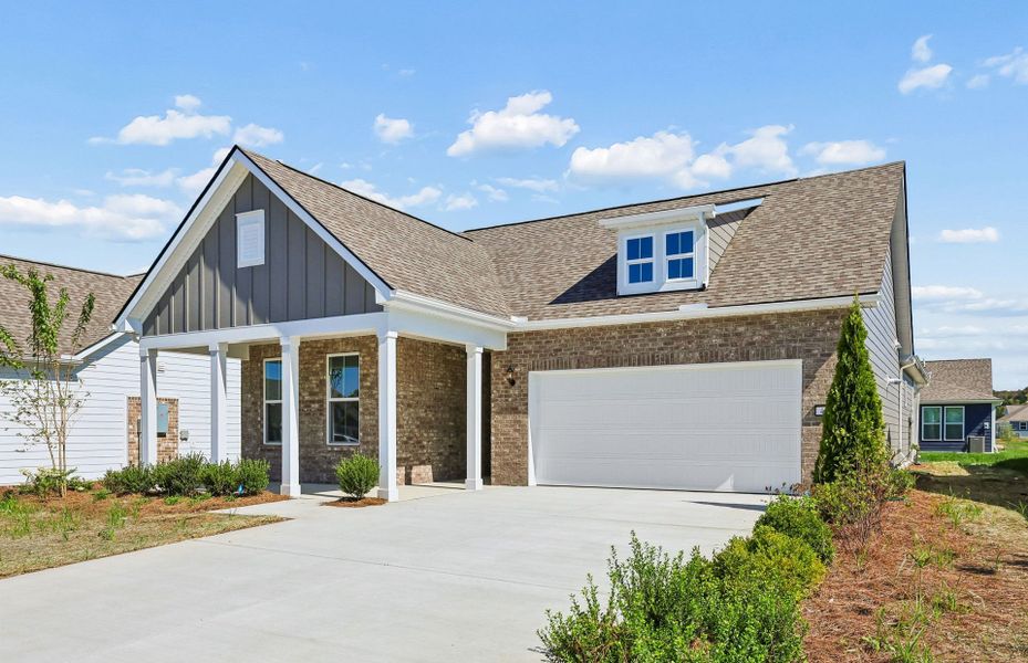 Front exterior of a new home in Del Webb Southern Harmony, Murfreesboro, TN, highlighting curb appeal (Image 21).