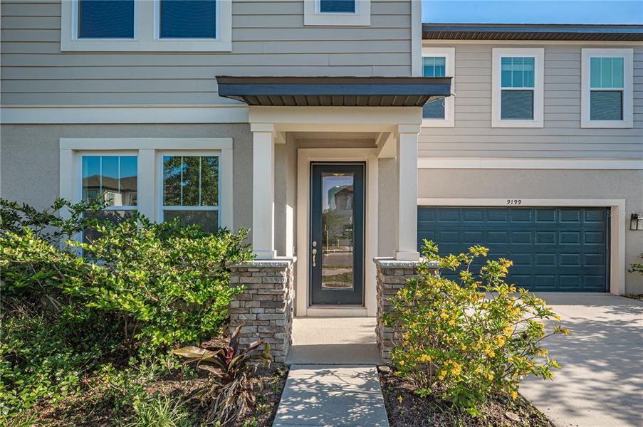 Front exterior of a new home in , Orlando, FL, highlighting curb appeal (Image 13). Front exterior of a new home in , Orlando, FL, highlighting curb appeal (Image 13).