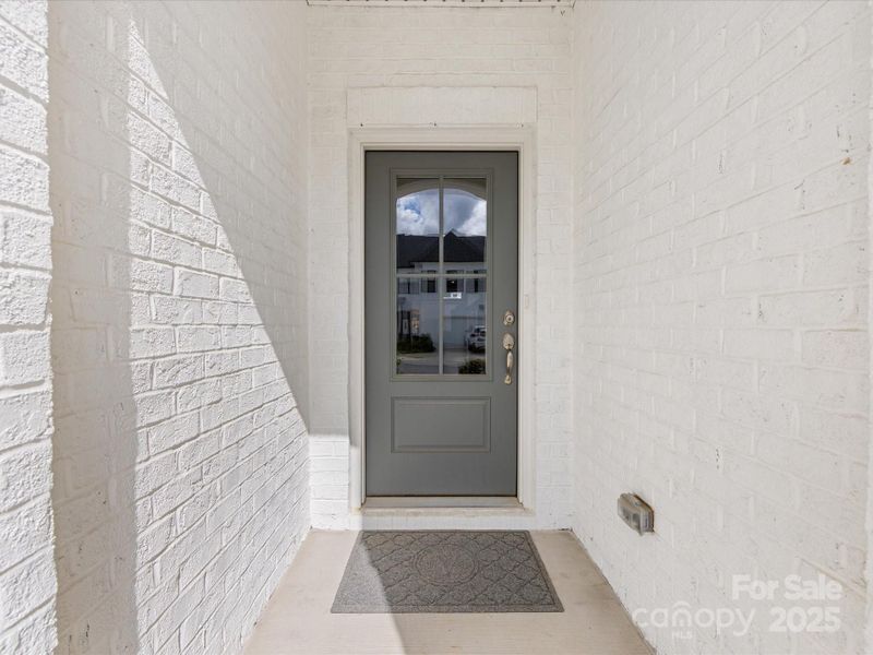 Exterior details and patio area of a home in Towns at Rea Colony, Charlotte (Image 23).