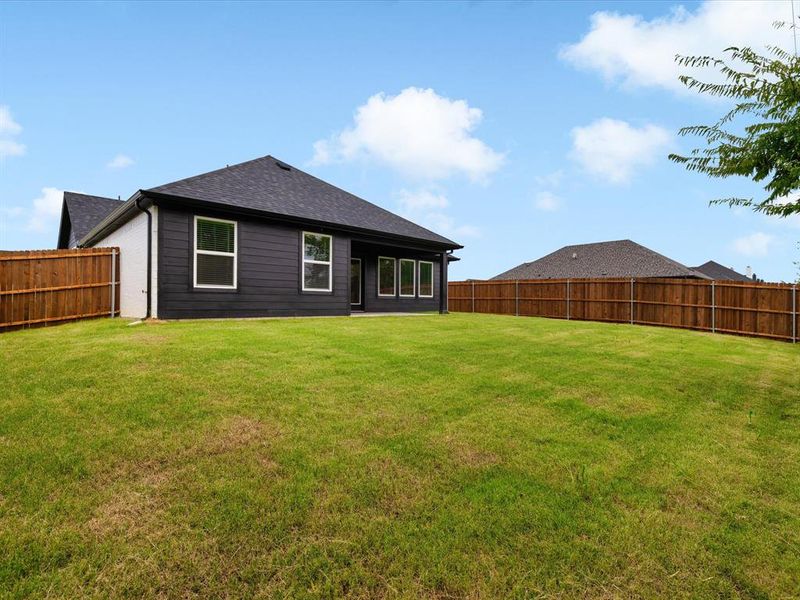 Exterior details and patio area of a home in Hadley Farms, Godley (Image 26).