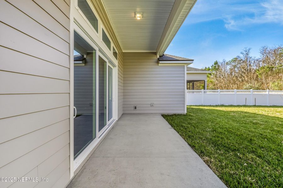 Exterior details and patio area of a home in Silver Landing at SilverLeaf, St. Augustine (Image 38).