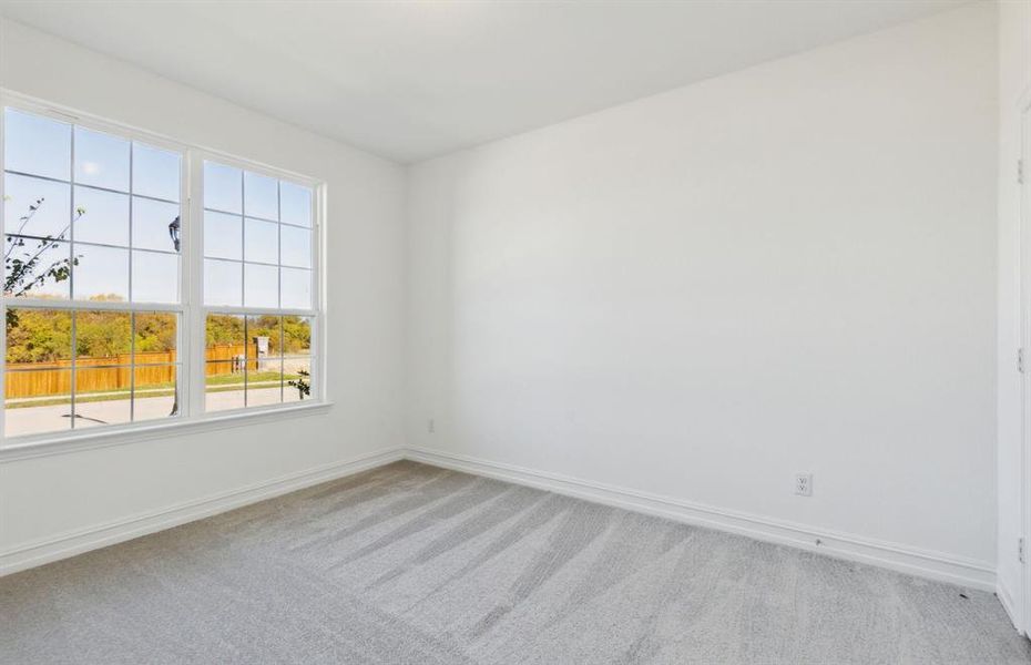 Spacious secondary bedroom with ample closet space *real home pictured