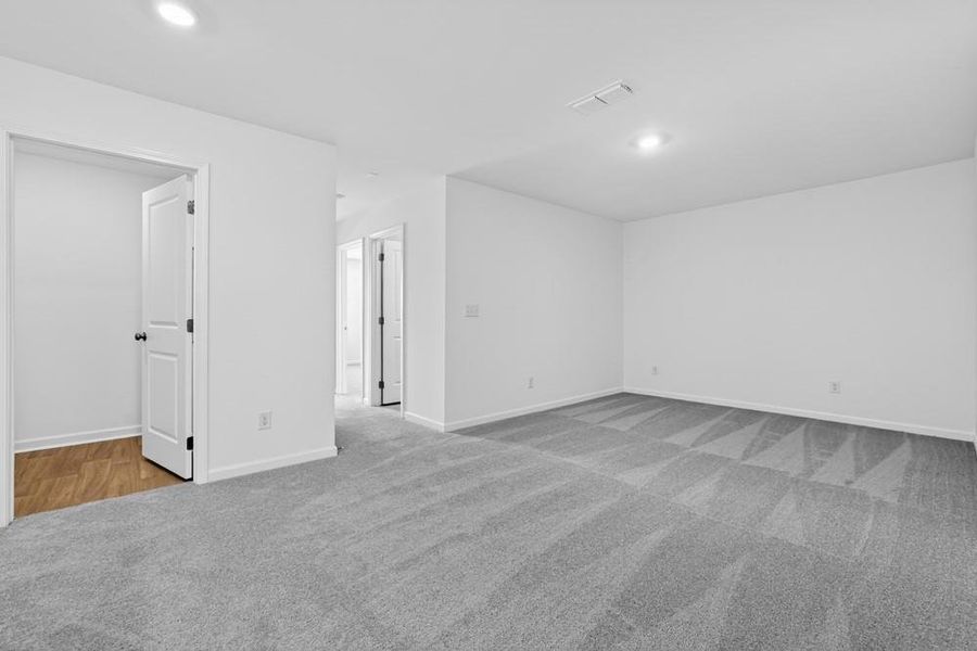 Spacious, unfurnished interior of a new home in Weatherfield, Buford (Image 27).