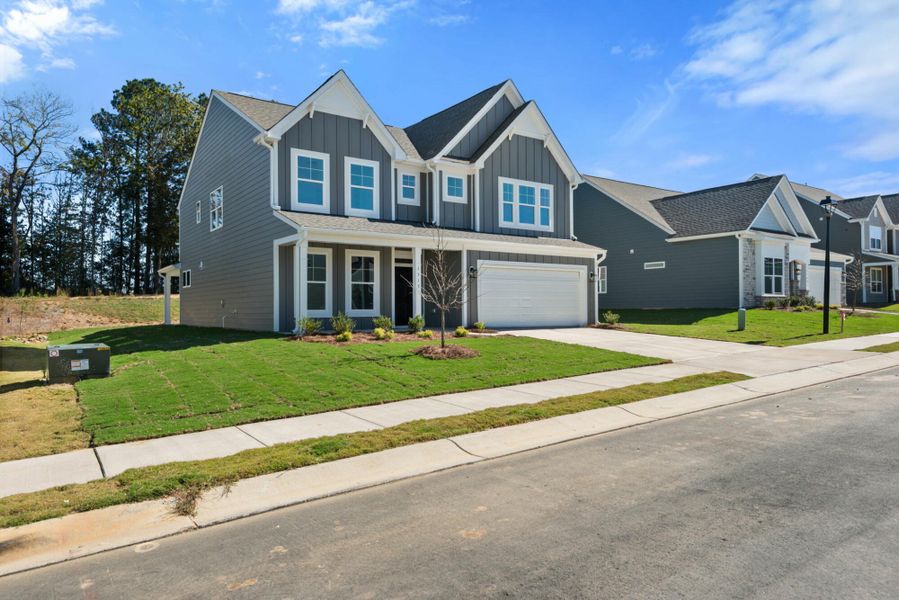 Front exterior of a new home in Wexford, Elon, NC, highlighting curb appeal (Image 24). Front exterior of a new home in Wexford, Elon, NC, highlighting curb appeal (Image 24).