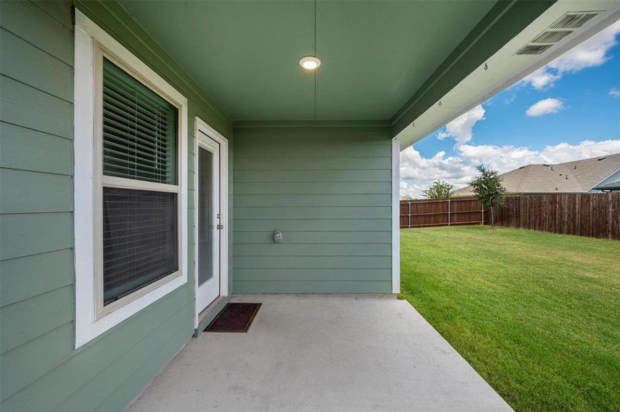 Exterior details and patio area of a home in Windrose, Pilot Point (Image 3). Exterior details and patio area of a home in Windrose, Pilot Point (Image 3).