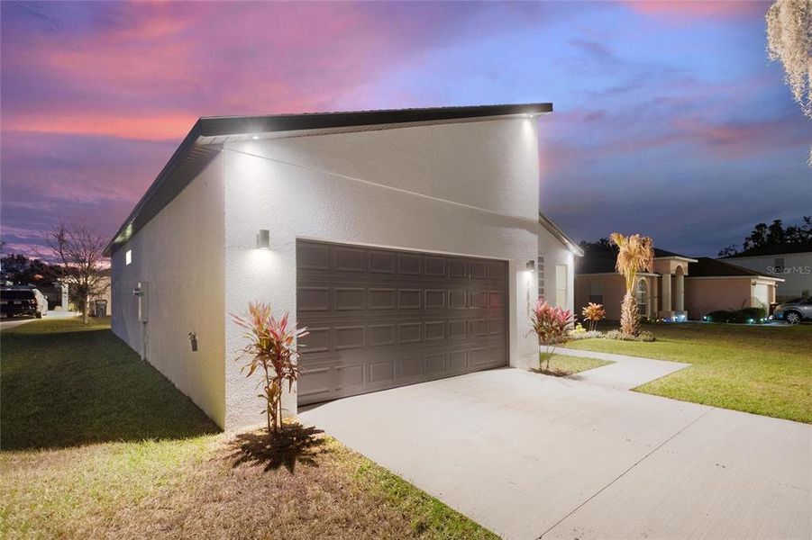 Front exterior of a new home in , Kissimmee, FL, highlighting curb appeal (Image 19).