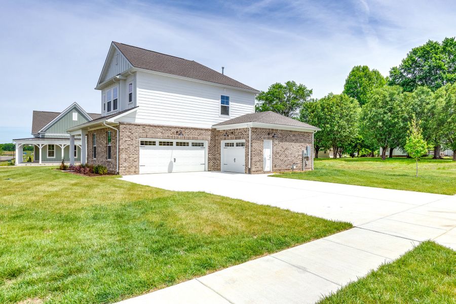 Front exterior of a new home in Rutherford, Columbia, TN, highlighting curb appeal (Image 24). Front exterior of a new home in Rutherford, Columbia, TN, highlighting curb appeal (Image 24).