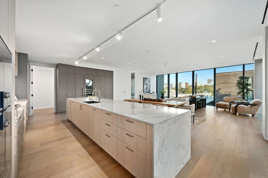 Kitchen/Dining/Living - Photo is of a staged model or similar unit and is for illustrative purposes only.