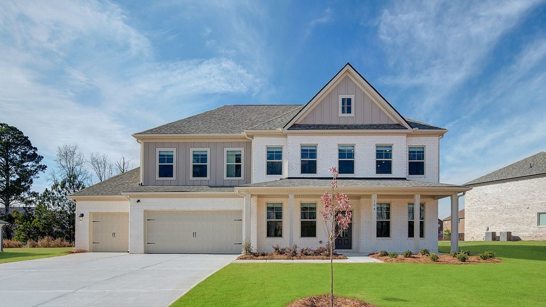 Representative exterior photo of a completed home built from the Stonefield by DRB Homes in Cambria at Traditions, Hampton, GA (Image 20). Representative exterior photo of a completed home built from the Stonefield by DRB Homes in Cambria at Traditions, Hampton, GA (Image 20).