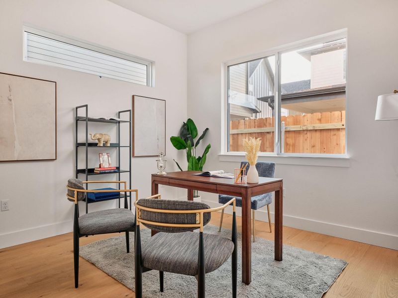 Office with baseboards and light wood finished floors