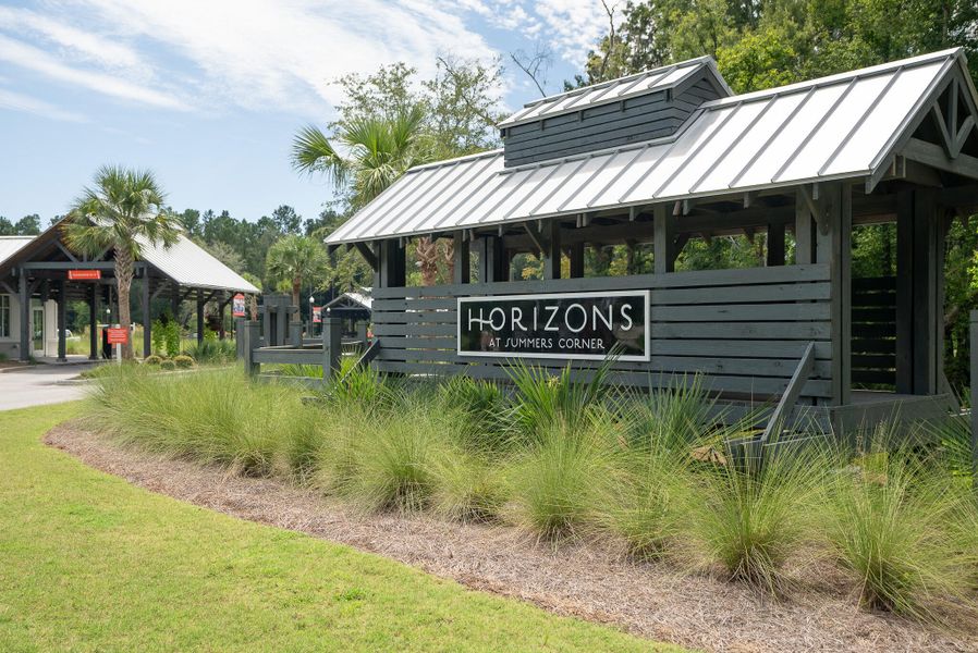 Front exterior of a new home in Horizons at Summers Corner | 55+: The Estates, Summerville, SC, highlighting curb appeal (Image 29).