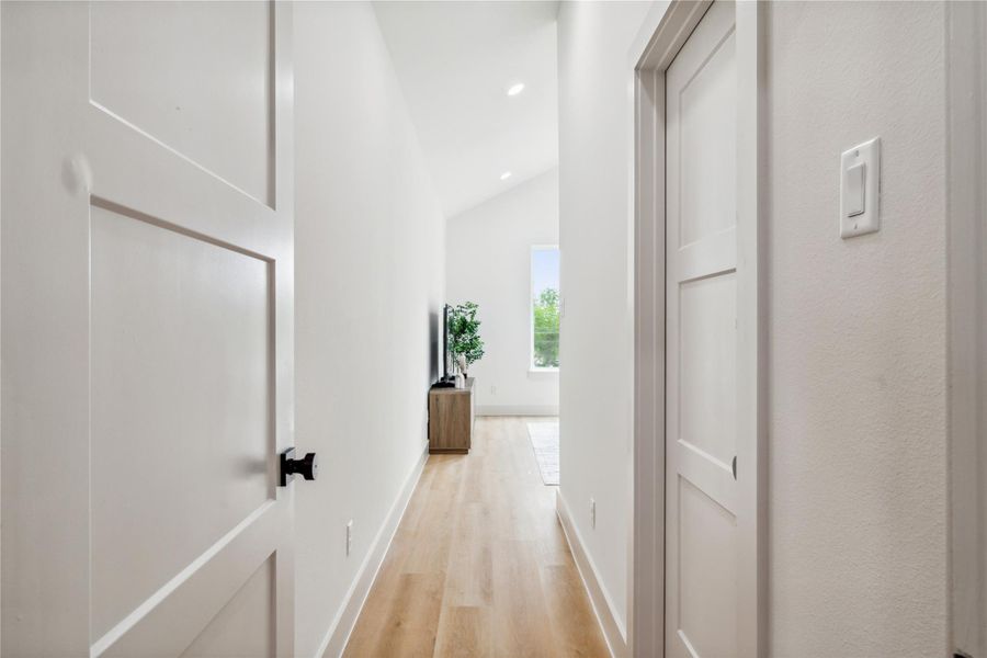 A private hallway leads you to the primary suite, setting the tone for the serene retreat that awaits.