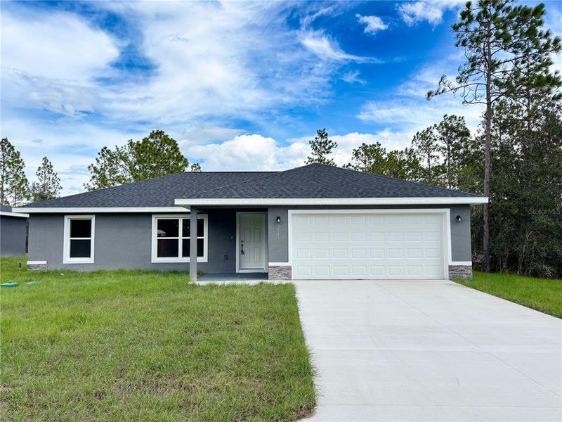 Front exterior of a new home in , Dunnellon, FL, highlighting curb appeal (Image 2). Front exterior of a new home in , Dunnellon, FL, highlighting curb appeal (Image 2).