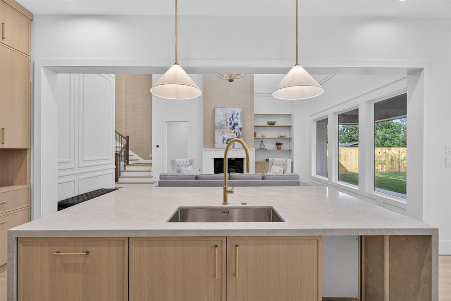 The expansive Taj Mahal quartzite waterfall island offers generous prep space, seating, and a statement centerpiece for gathering with family and friends. The expansive Taj Mahal quartzite waterfall island offers generous prep space, seating, and a statement centerpiece for gathering with family and friends.