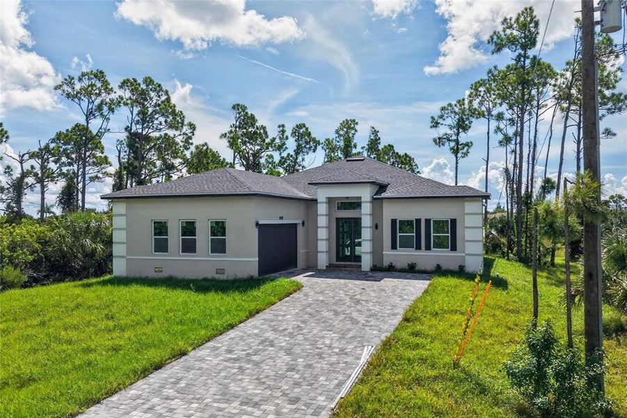 Front exterior of a new home in , Port Charlotte, FL, highlighting curb appeal (Image 29).