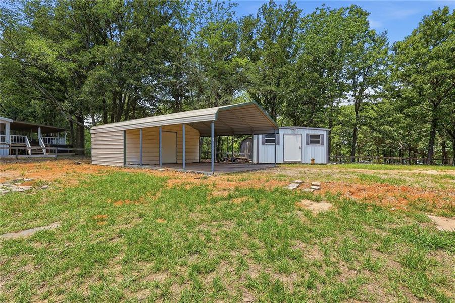 2 vehicle car port with storage area. Electricity to the storage area of the carport.