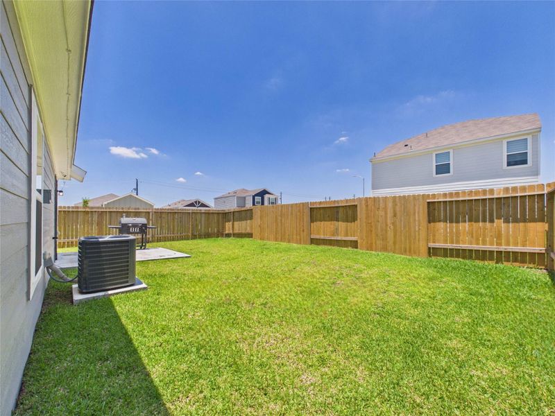 Exterior details and patio area of a home in Park Vista at El Tesoro, Houston (Image 28).