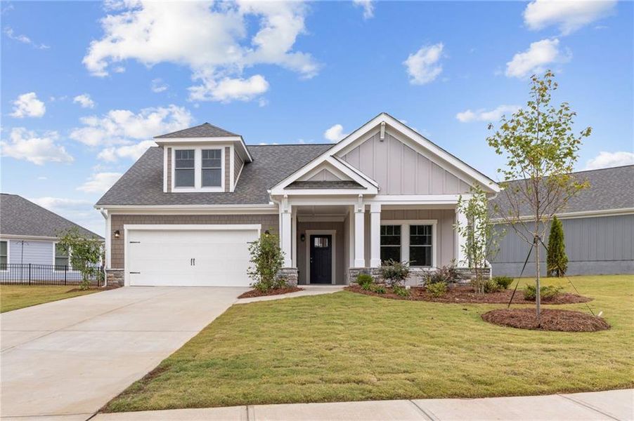 Front exterior of a new home in The Courtyards at Bailey Farm, Dacula, GA, highlighting curb appeal (Image 2).