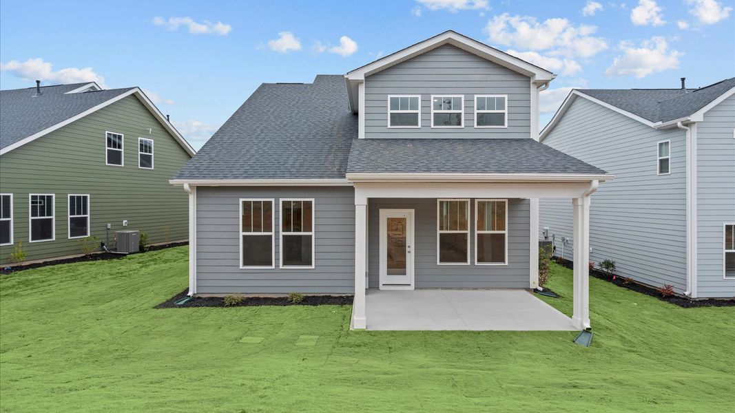 Highly functional rear covered porch adds memorable living space to this elegant home in Moore, SC
