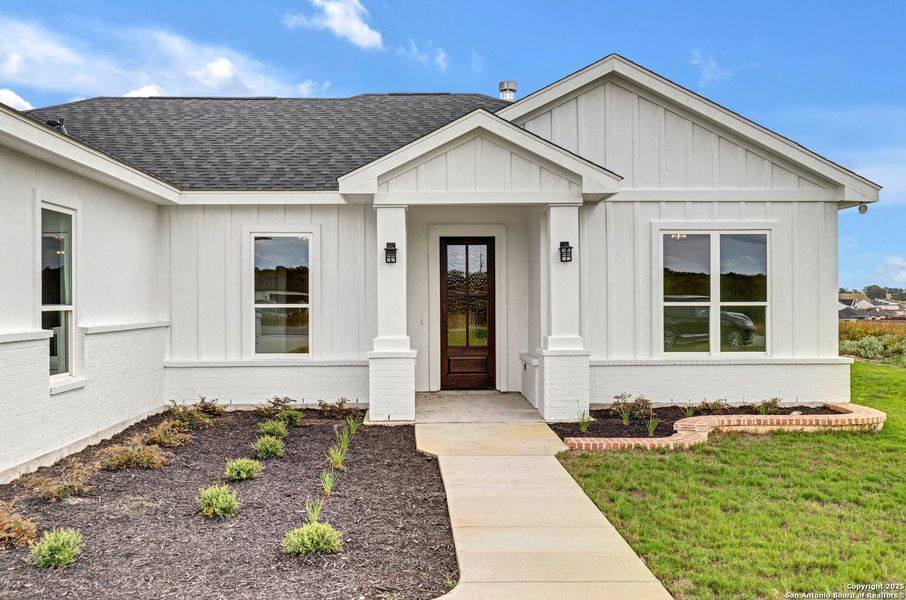 Front exterior of a new home in , La Vernia, TX, highlighting curb appeal (Image 30). Front exterior of a new home in , La Vernia, TX, highlighting curb appeal (Image 30).