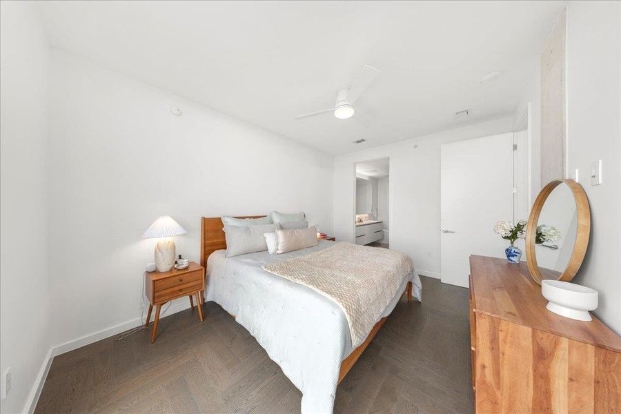 Light-filled primary bedroom with panoramic views and a connected ensuite bath, creating a serene and modern retreat. Light-filled primary bedroom with panoramic views and a connected ensuite bath, creating a serene and modern retreat.