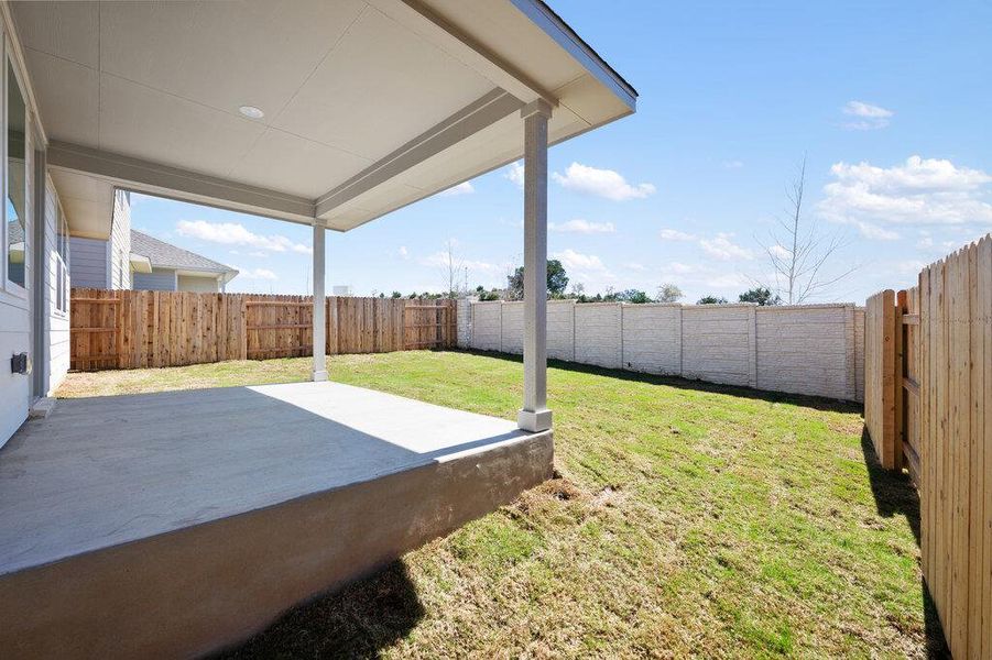 Exterior details and patio area of a home in Cannon Ranch, Dripping Springs (Image 27).