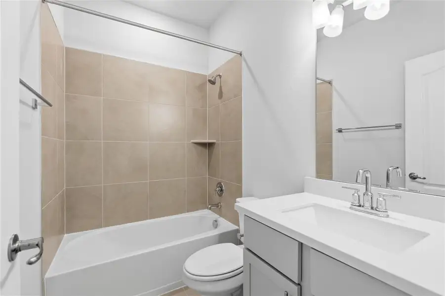 Bathroom featuring shower / tub combination and vanity Bathroom featuring shower / tub combination and vanity