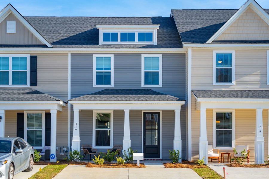 Front exterior of a new home in Abbey Walk, Moncks Corner, SC, highlighting curb appeal (Image 27). Front exterior of a new home in Abbey Walk, Moncks Corner, SC, highlighting curb appeal (Image 27).