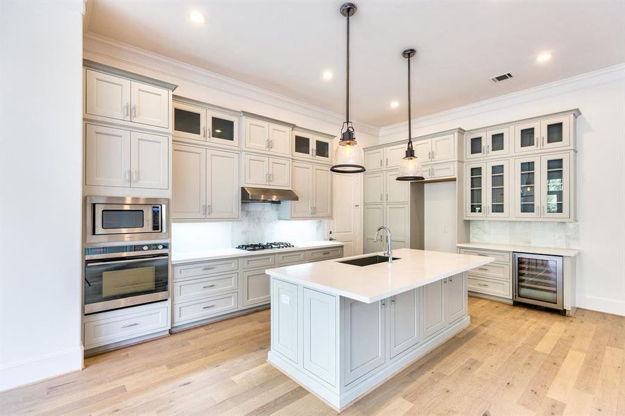 Kitchen features high end stainless steel appliances.