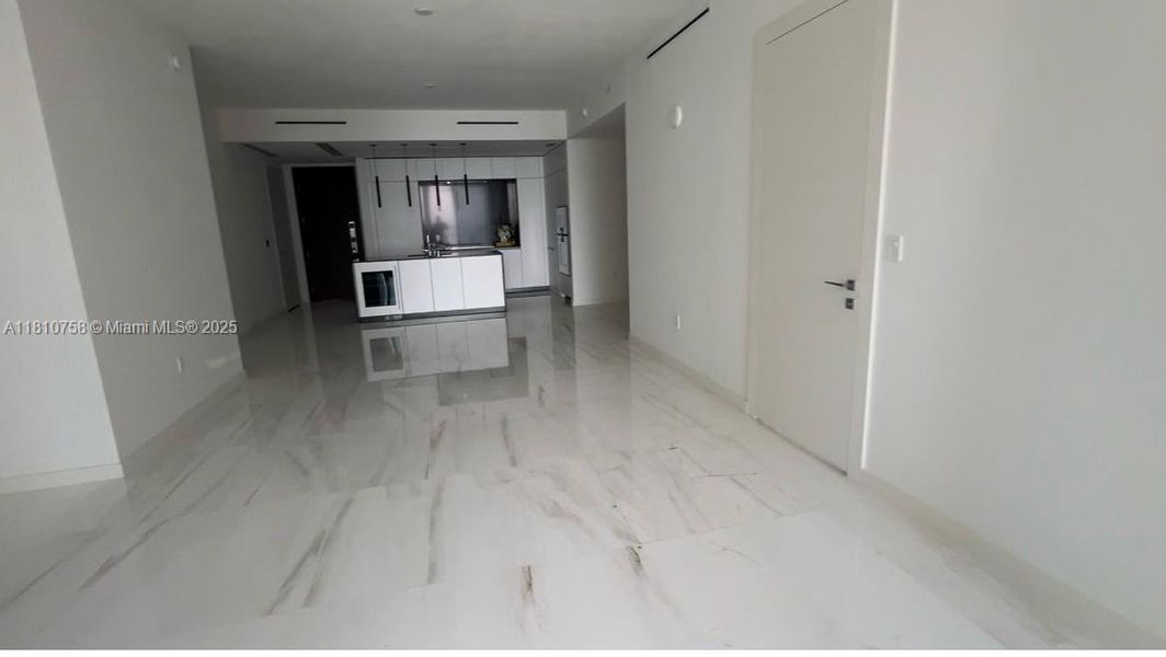 Spacious, unfurnished interior of a new home in Aston Martin Residences, Miami (Image 19).