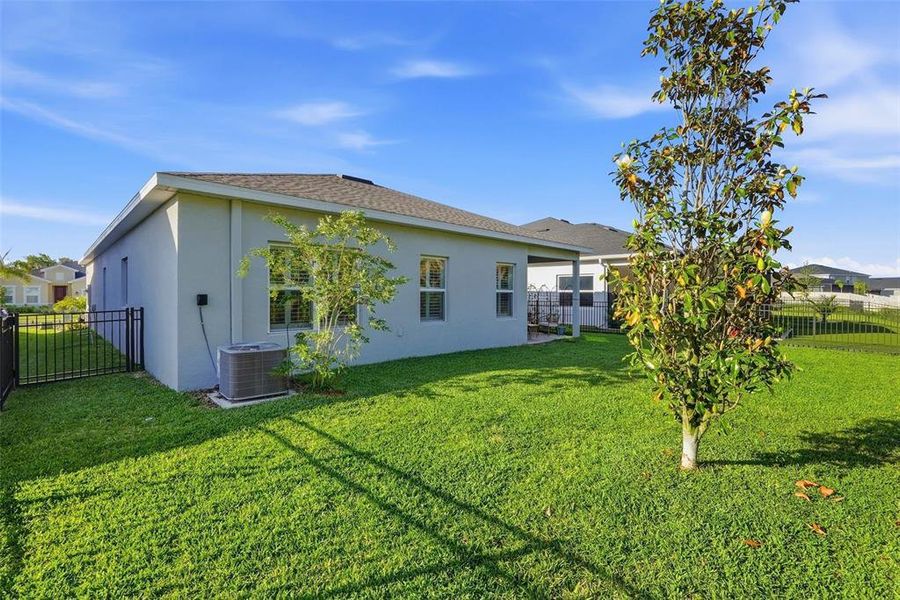 Exterior details and patio area of a home in , Parrish (Image 3).