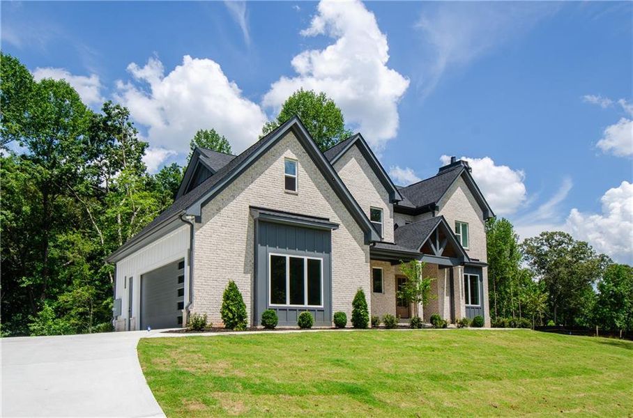 Front exterior of a new home in , Hoschton, GA, highlighting curb appeal (Image 2). Front exterior of a new home in , Hoschton, GA, highlighting curb appeal (Image 2).