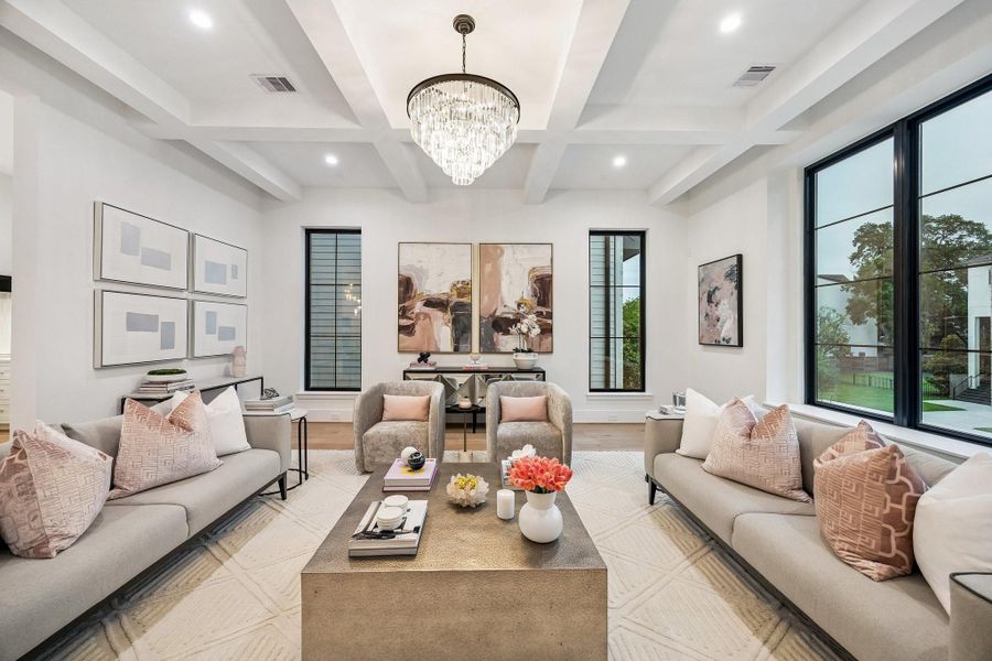 Ceiling with Painted Boxed Beam Detailing with a Modern Tiered Crystal LED Chandelier.  Beautiful Anderson Divided Lite Windows.