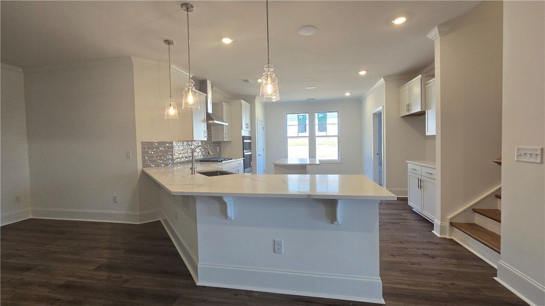 A well-appointed kitchen showcasing elegant pendan